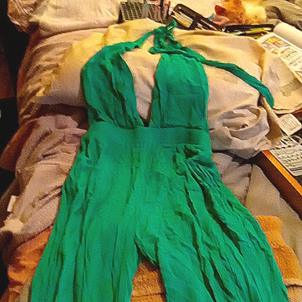 An Emerald colored size medium jumper rumper Comfortable and sexy